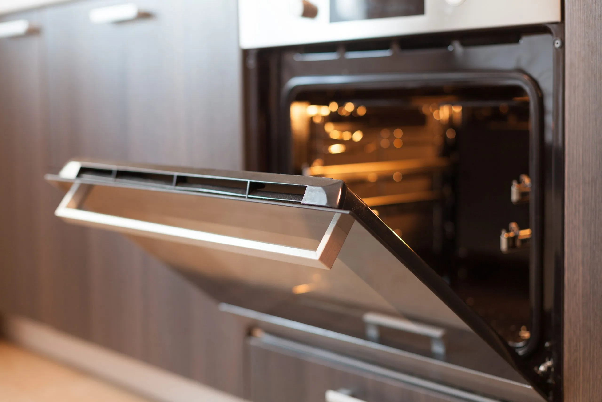 Built-in oven open in a Chattanooga-area kitchen, repaired by Appliance 911